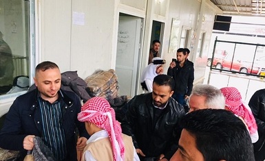 Hammurabi Human Rights Organization continues its relief support to Yazidis in the camp Kertu 3 in Duhok by distributing rain jackets to (156) male and female children.