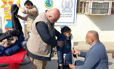 In Sadr City, Baghdad: Hammurabi Organization distributes Winter Clothes to Orphan Schools