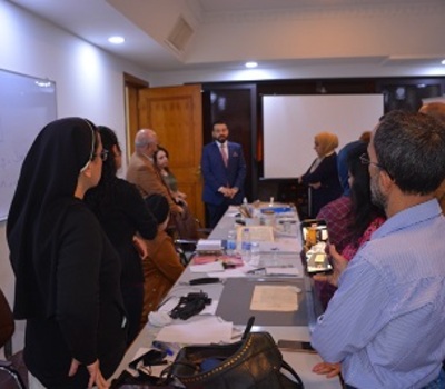 Ahmed Aleyawi, Director General of the House of Manuscripts, inspects the training workshop for manuscript protection
