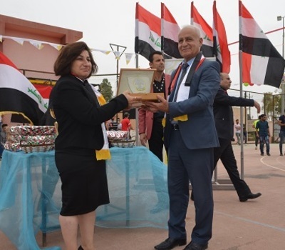 The Presidency of Al-Hamdaniya University awards Mrs. Pascale Warda the shield of the university entitled 