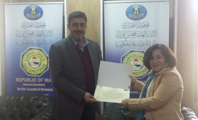 Mrs. Pascale Warda receive an appreciation certificate from the General Secretariat of the Council of Ministers