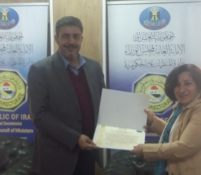 Mrs. Pascale Warda receive an appreciation certificate from the General Secretariat of the Council of Ministers