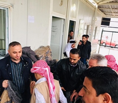Hammurabi Human Rights Organization continues its relief support to Yazidis in the camp Kertu 3 in Duhok by distributing rain jackets to (156) male and female children.